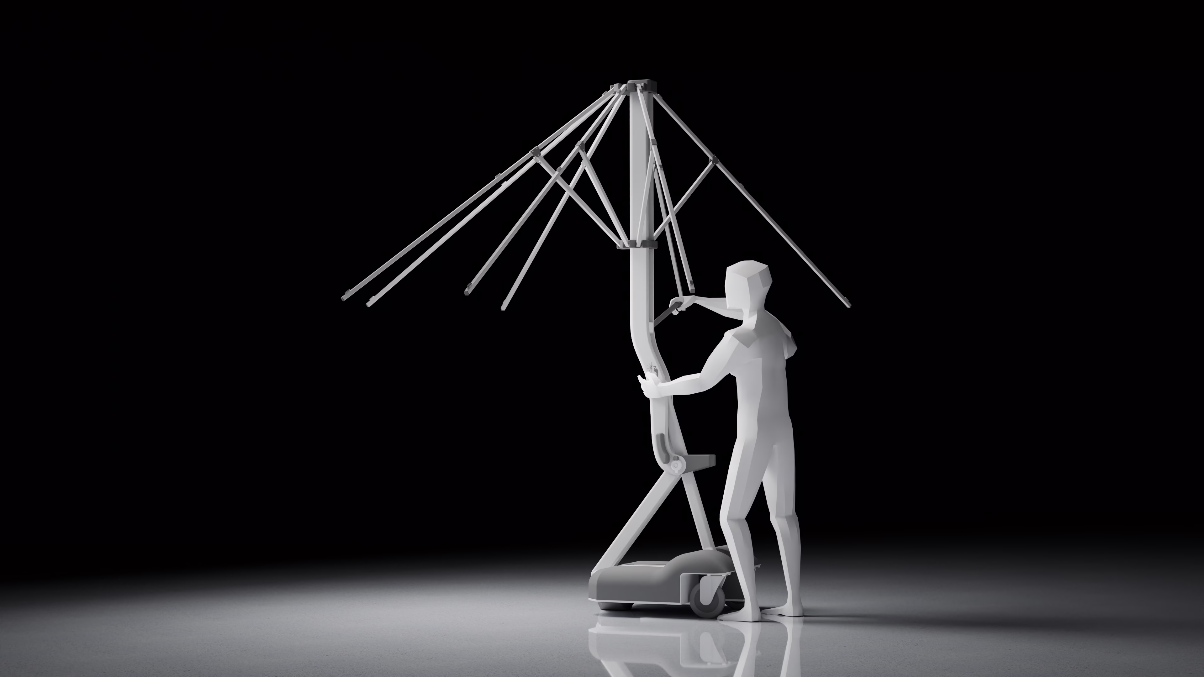 The umbrella halfway through opening, a person at the crank