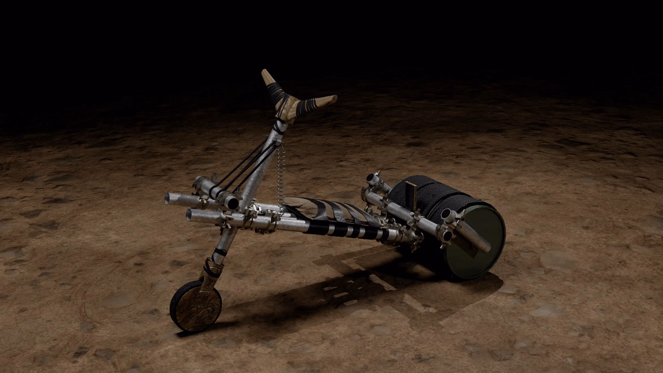 The Industrial Chukudu: a scaffolding-tube frame on a drum wheel, on bare ground