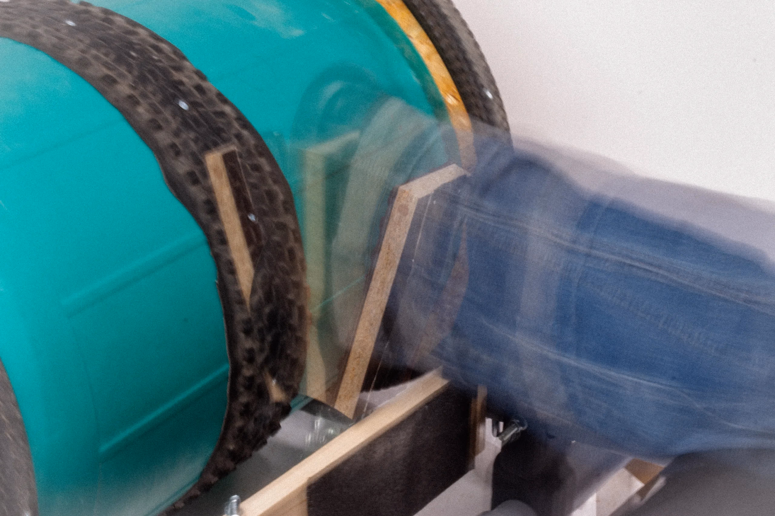 A foot pushing the prototype: the drum wheel turning