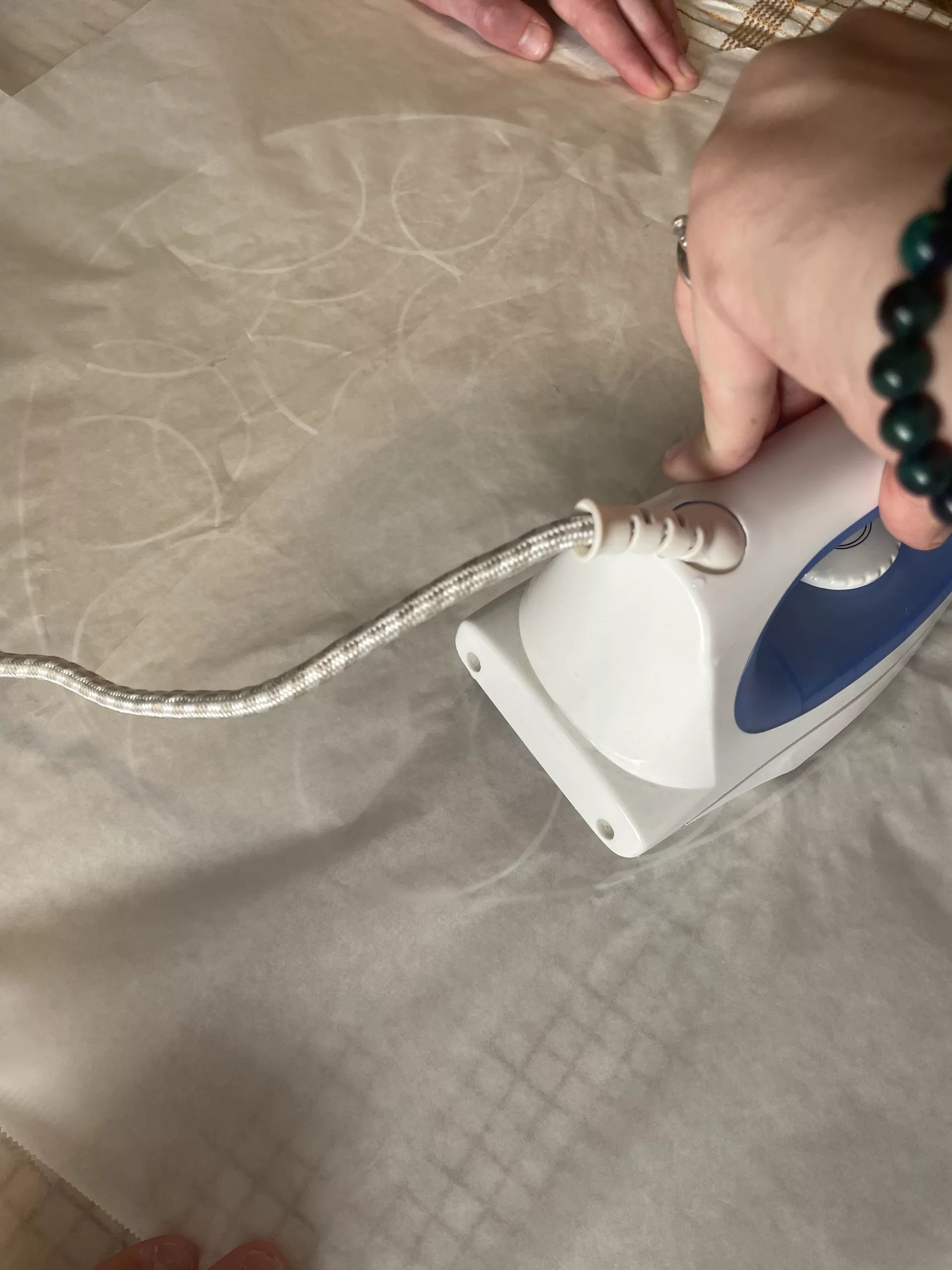 A clothes iron pressed over the rings through baking paper