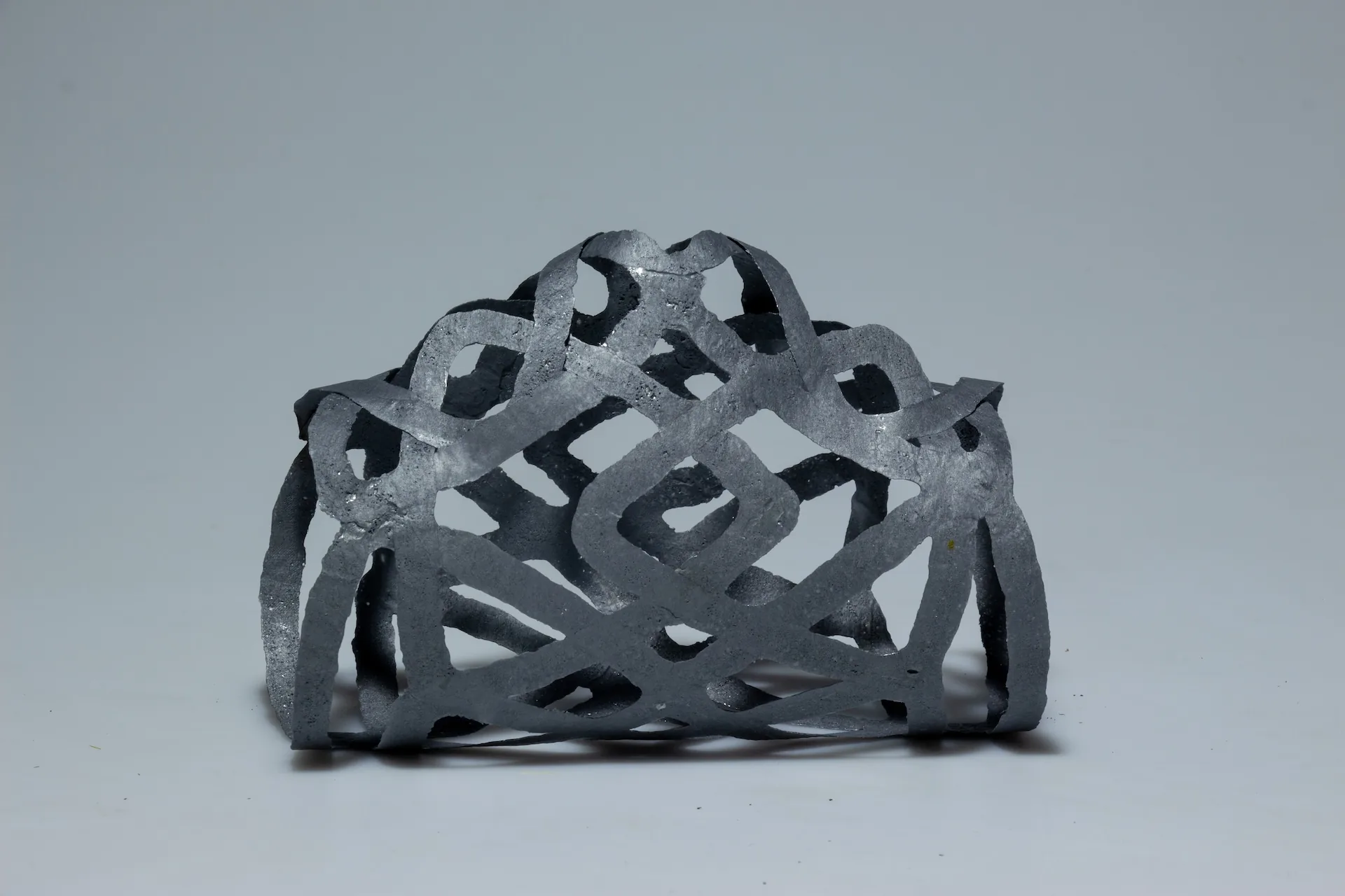 The PLArt bottle holder, a half-round lattice of fused strips