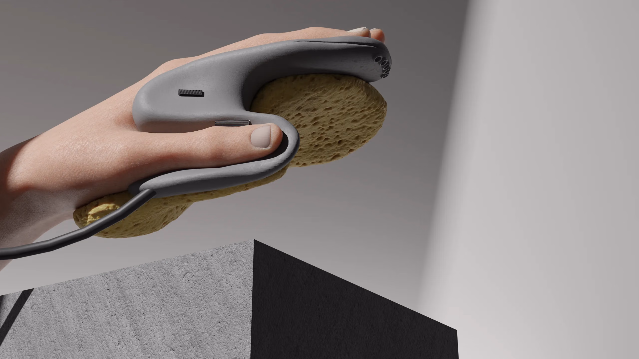 The sponge held in one hand, the grip curved around the thumb