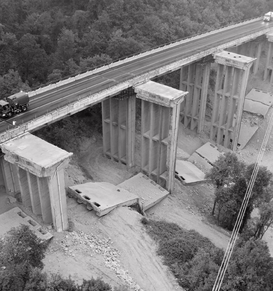 A motorway viaduct under construction, with new piers next to the old ones