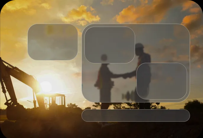 Frosted glass panels over a photo of two workers shaking hands at sunset